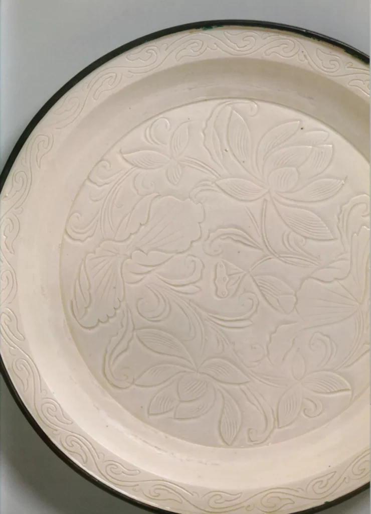 White porcelain carved flower plate